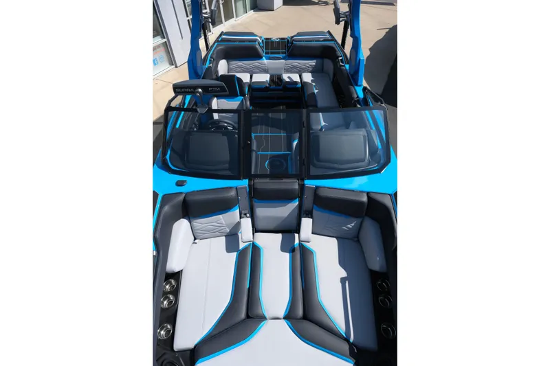 Slide: The Image of 2026 Supra SA450 boat interior with blue and gray seating, showcasing modern design. - 14