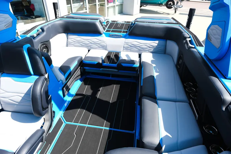 Slide: The Image of Luxurious interior of 2026 Supra SA450 boat with blue and white seating. - 15
