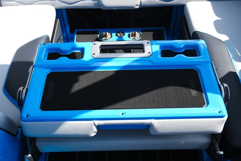 Slide: The Image of 2026 Supra SA450 boat interior with blue and black seating and cup holders. - 25