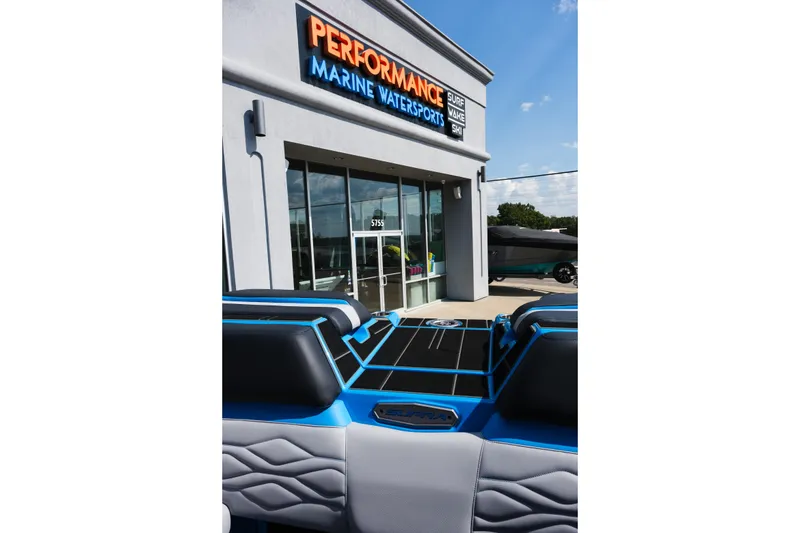Slide: The Image of 2026 Supra SA450 boat at Performance Marine Watersports dealership entrance. - 27