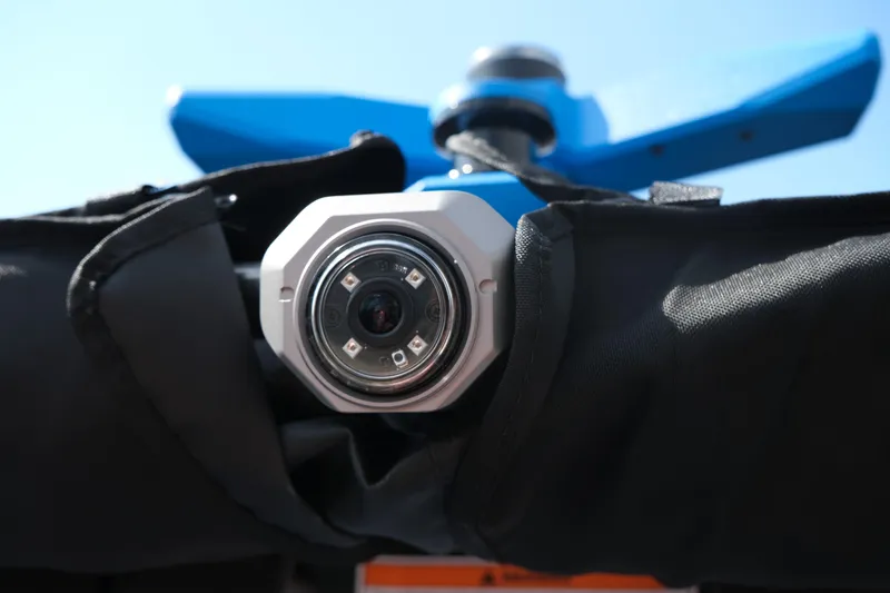 Slide: The Image of Close-up of a Supra SA450 camera lens, 2026 model, with blue background. - 30