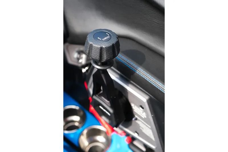 Slide: The Image of Interior of 2026 Supra SA450 with thrust control lever and cup holders. - 33