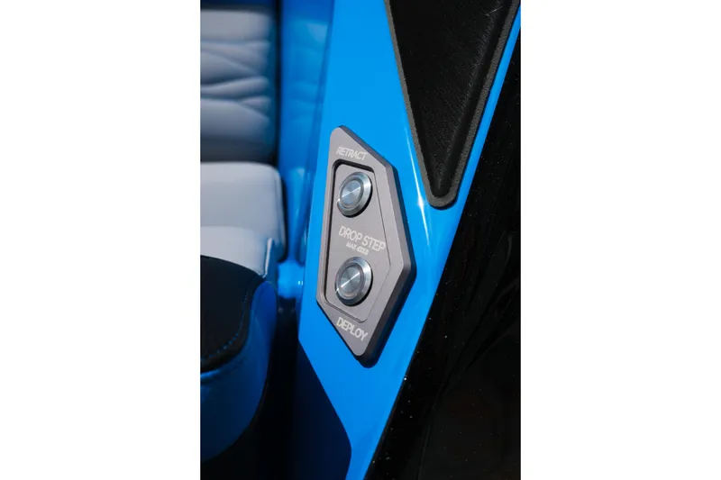 Slide: The Image of Interior control panel of 2026 Supra SA450 with retract and deploy buttons. - 50