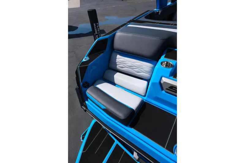 Slide: The Image of 2026 Supra SA450 boat seat with blue and gray upholstery, featuring modern design and cup holder. - 8