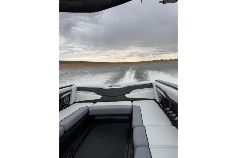 Slide: The Image of 2022 Axis T250 boat interior with wake trail on a cloudy day. - 3