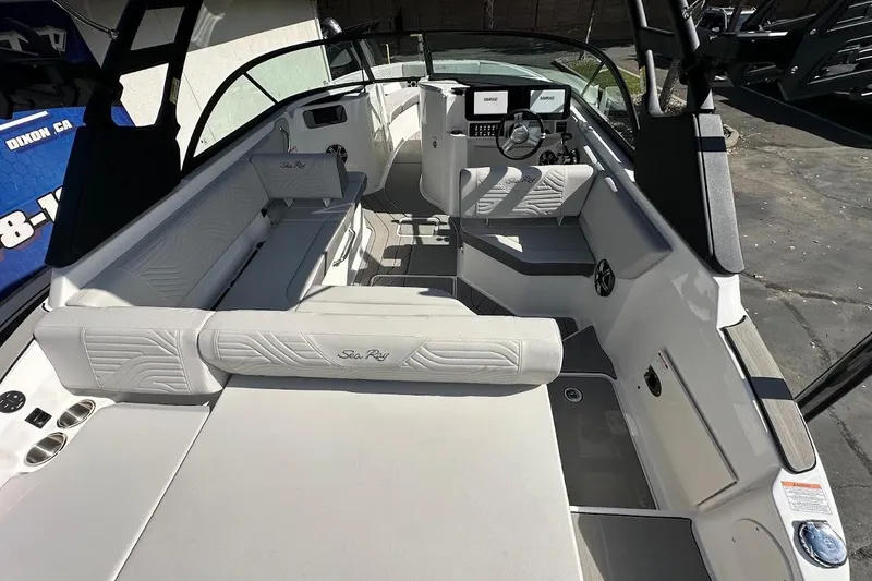 Slide: The Image of 2026 Sea Ray SDX 230 Surf boat interior with modern seating and dashboard. - 15