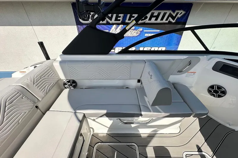 Slide: The Image of 2026 Sea Ray SDX 230 Surf boat interior with sleek seating and modern design. - 19