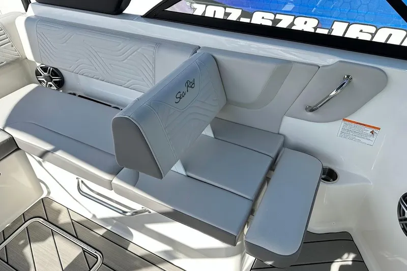 Slide: The Image of 2026 Sea Ray SDX 230 Surf boat interior seating with gray upholstery and sleek design. - 21