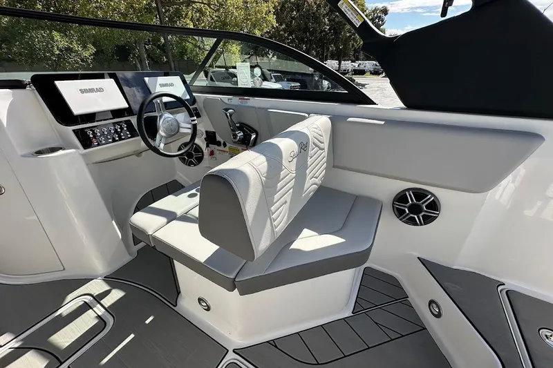 Slide: The Image of Interior of 2026 Sea Ray SDX 230 Surf boat with modern dashboard and seating. - 23