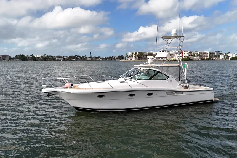 The Image of 2007 Tiara Yachts 3600 Open cruising on a calm waterway under a partly cloudy sky. - 0