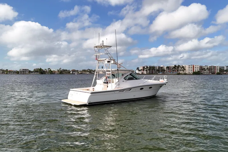 Slide: The Image of 2007 Tiara Yachts 3600 Open on calm water under a partly cloudy sky. - 11