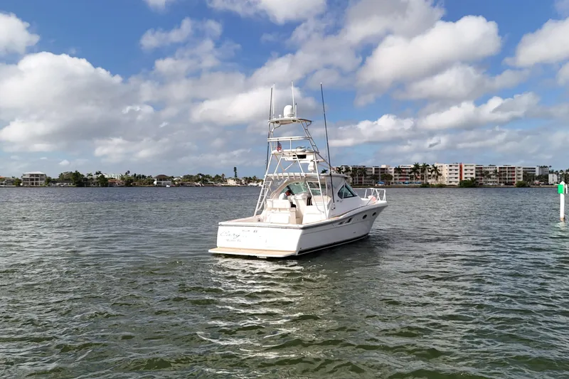 Slide: The Image of 2007 Tiara Yachts 3600 Open on calm water under a partly cloudy sky. - 12