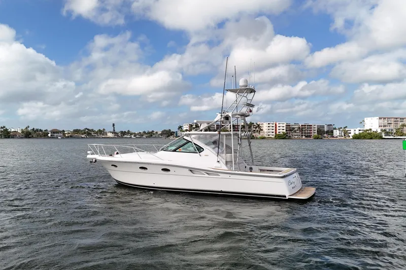 Slide: The Image of 2007 Tiara Yachts 3600 Open on water, under a partly cloudy sky. - 15