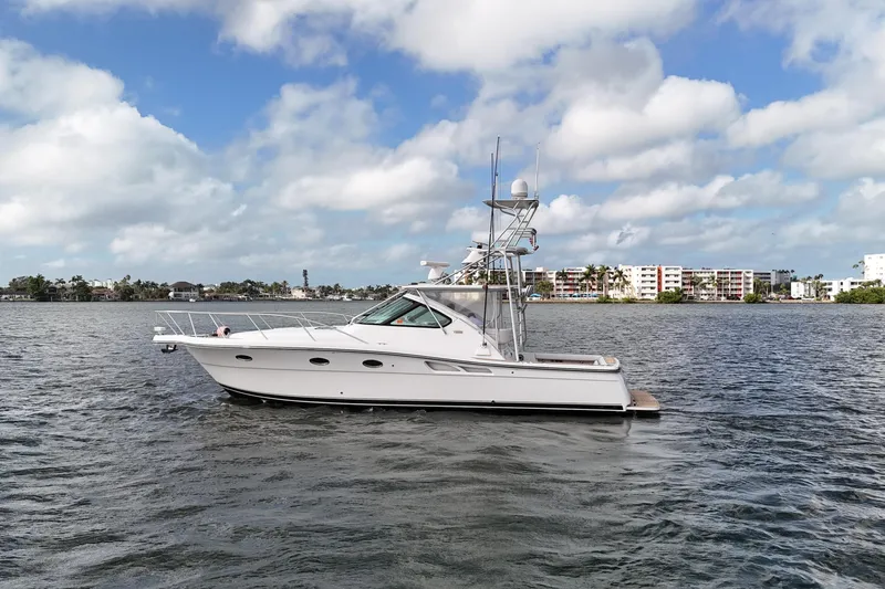 Slide: The Image of 2007 Tiara Yachts 3600 Open on water, under a partly cloudy sky. - 16