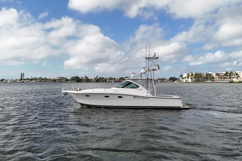 Slide: The Image of 2007 Tiara Yachts 3600 Open cruising on a scenic waterway under a partly cloudy sky. - 17