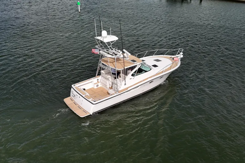 Slide: The Image of 2007 Tiara Yachts 3600 Open cruising on calm waters, aerial view. - 18