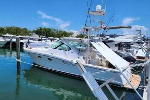 Slide: The Image of 2007 Tiara Yachts 3600 Open docked in a marina under a clear blue sky. - 2