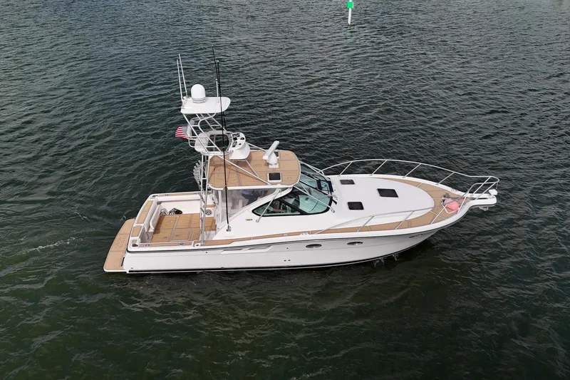 Slide: The Image of 2007 Tiara Yachts 3600 Open cruising on calm waters, side view. - 21