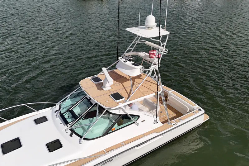 Slide: The Image of 2007 Tiara Yachts 3600 Open on water, featuring sleek design and spacious deck. - 26