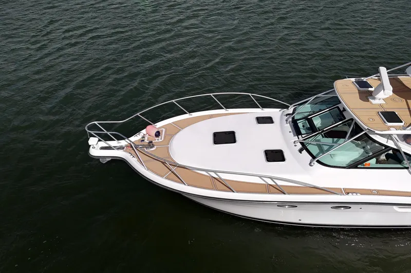 Slide: The Image of 2007 Tiara Yachts 3600 Open cruising on water, aerial view of sleek design and deck layout. - 27