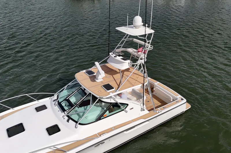 Slide: The Image of 2007 Tiara Yachts 3600 Open on water, showcasing sleek design and spacious deck. - 28