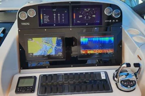 Slide: The Image of Dashboard of a 2007 Tiara Yachts 3600 Open with navigation and control systems. - 31