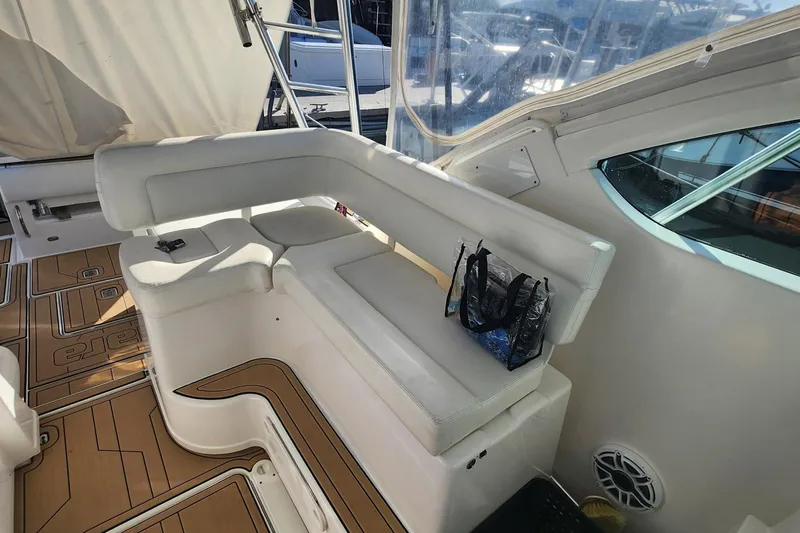 Slide: The Image of 2007 Tiara Yachts 3600 Open interior with white seating and teak flooring. - 35