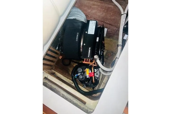 Slide: The Image of 2007 Tiara Yachts 3600 Open engine compartment with visible components and wiring. - 36