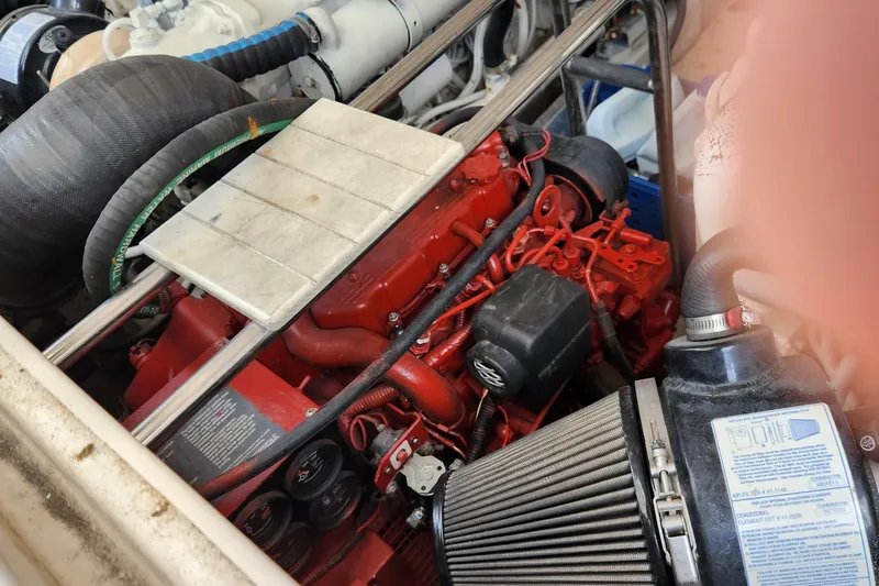 Slide: The Image of Engine compartment of a 2007 Tiara Yachts 3600 Open, showcasing red engine components. - 44