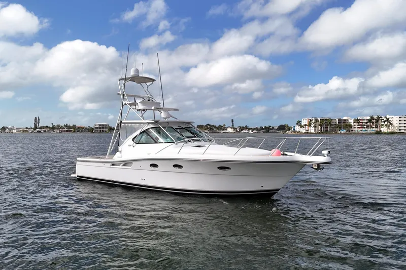 Slide: The Image of 2007 Tiara Yachts 3600 Open cruising on a sunny day with coastal buildings in the background. - 7