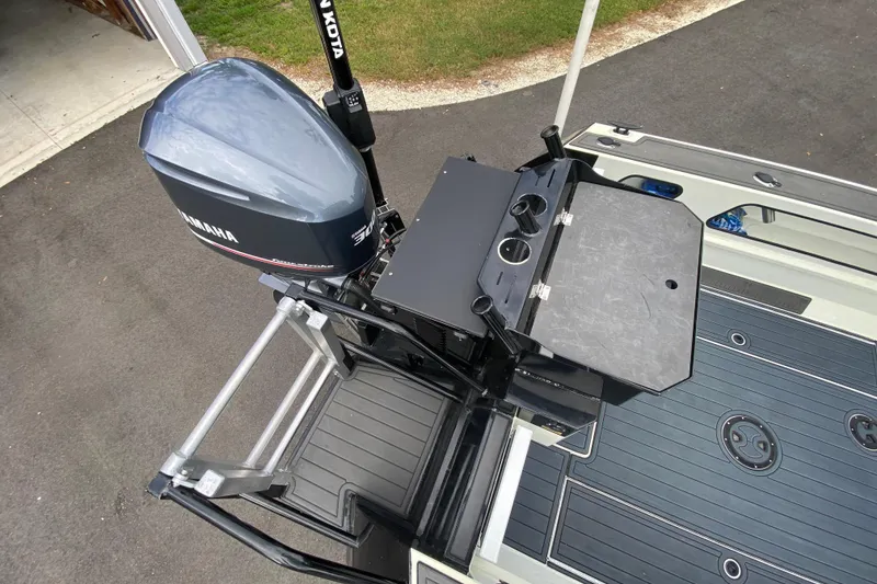 Slide: The Image of 2024 Sea King 260 boat with Yamaha motor and fishing setup on deck. - 22