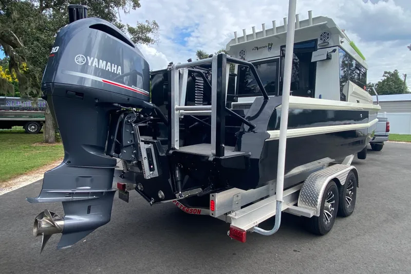 Slide: The Image of 2024 Sea King 260 boat with Yamaha outboard engine on a trailer. - 30