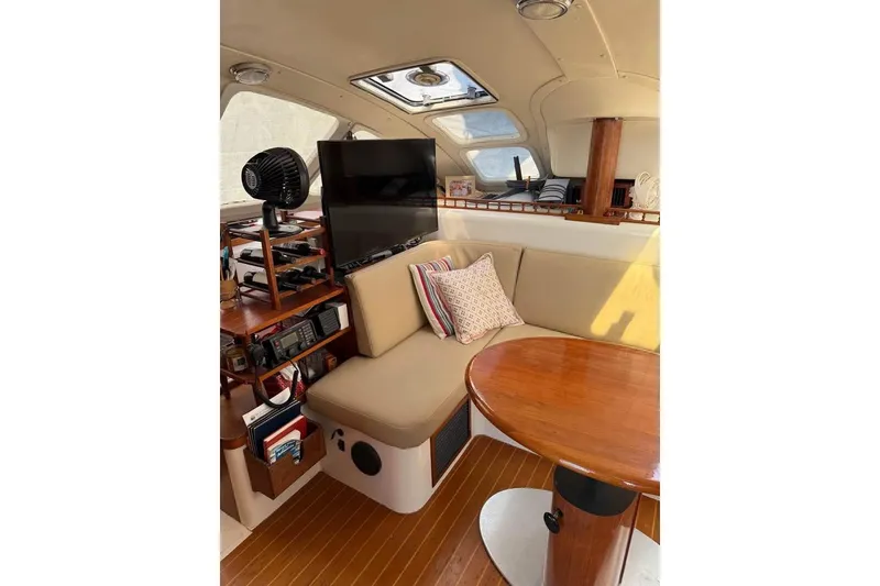 Slide: The Image of Interior of 1993 Jeanneau Lagoon 37 TPI Catamaran with cozy seating and wooden table. - 6