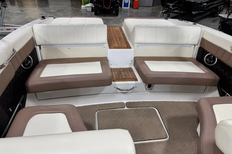 Slide: The Image of Interior of a 2011 Cobalt 296 boat with white and brown seating. - 10