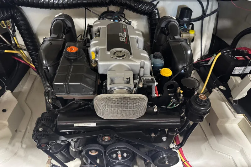 Slide: The Image of 2011 Cobalt 296 engine compartment showcasing a powerful inboard motor. - 15