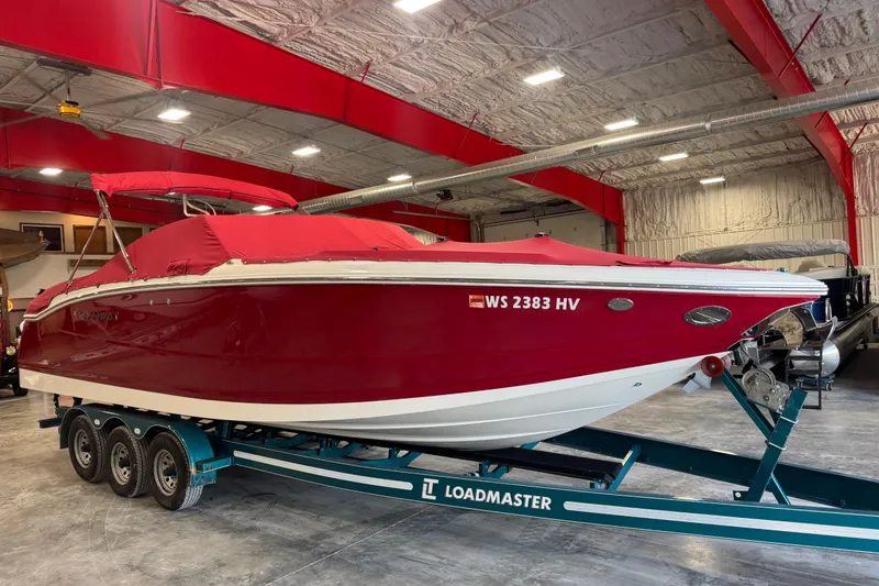 Slide: The Image of Red 2011 Cobalt 296 boat on Loadmaster trailer in indoor storage facility. - 5
