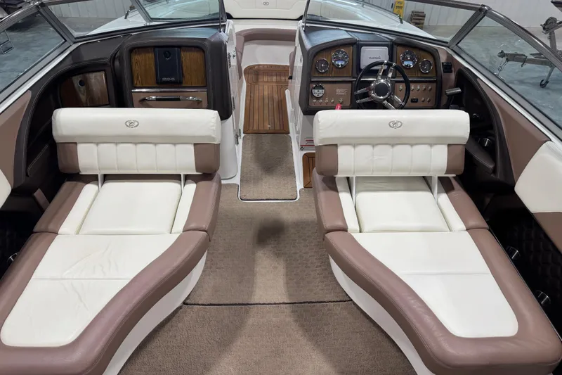 Slide: The Image of Interior of a 2011 Cobalt 296 boat with luxurious seating and modern dashboard. - 6