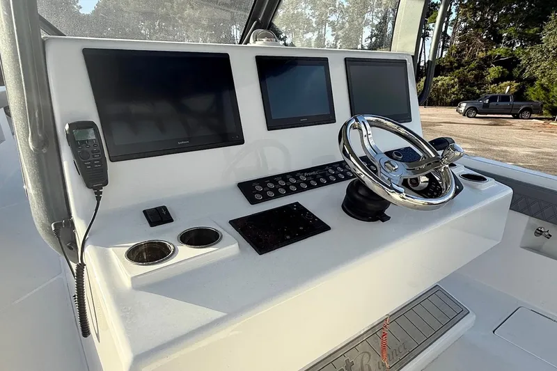 Slide: The Image of 2024 Front Runner 39 Center Console helm with advanced navigation displays and controls. - 11
