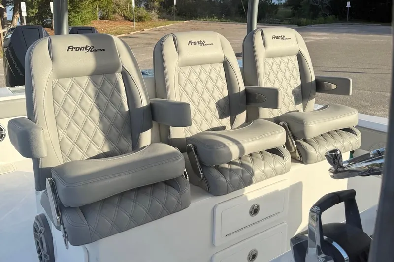 Slide: The Image of Luxurious seating on 2024 Front Runner 39 Center Console boat with diamond-stitched upholstery. - 13