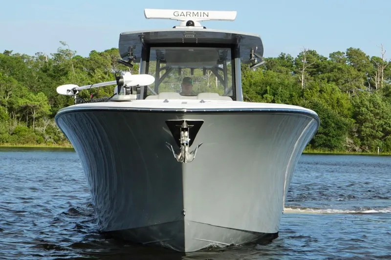 Slide: The Image of 2024 Front Runner 39 Center Console boat on water, featuring Garmin equipment. - 3