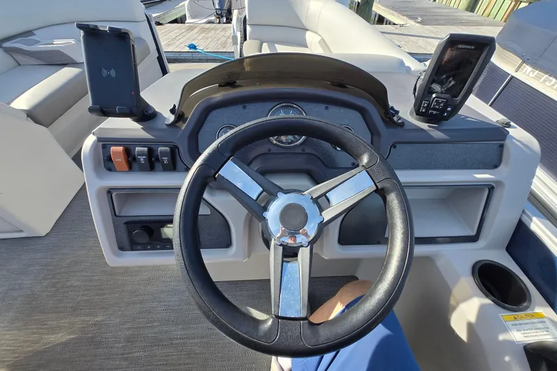 Slide: The Image of 2023 Godfrey Sweetwater 2286 SBX pontoon boat docked in a marina. - 15