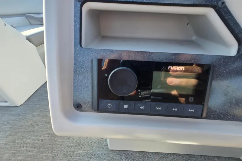 Slide: The Image of 2023 Godfrey Sweetwater 2286 SBX boat control panel with throttle and cup holder. - 17