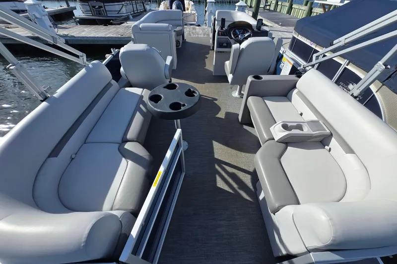 Slide: The Image of 2023 Godfrey Sweetwater 2286 SBX pontoon boat docked at marina. - 2