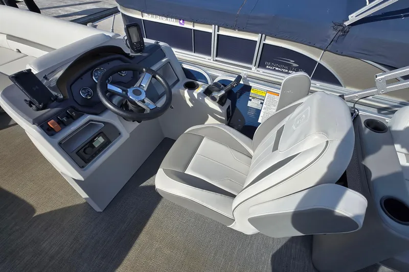 Slide: The Image of 2023 Godfrey Sweetwater 2286 SBX boat interior with gray seating and cup holder. - 7