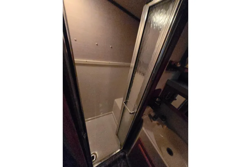 Slide: The Image of Shower area in 1988 Mainship 36 Double Cabin boat bathroom. - 23