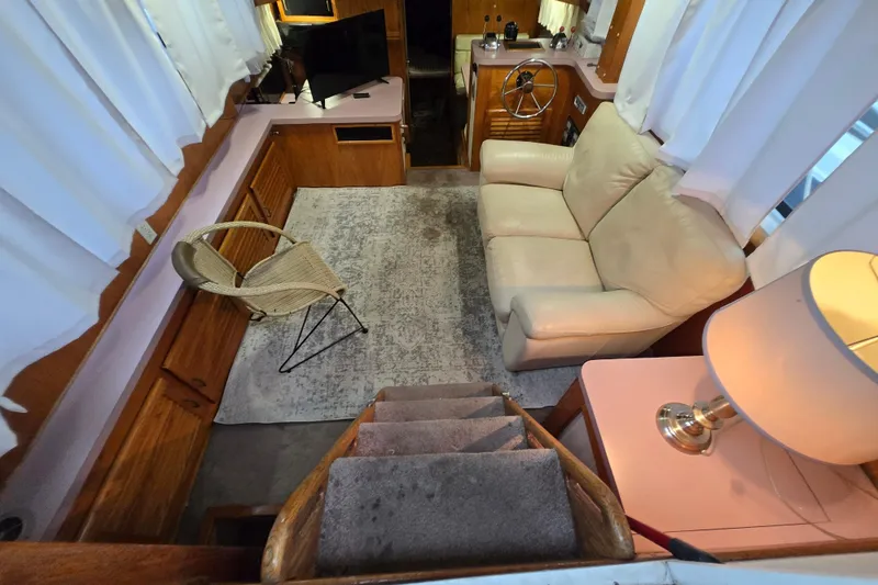 Slide: The Image of Interior of 1988 Mainship 36 Double Cabin with cozy seating and nautical decor. - 3