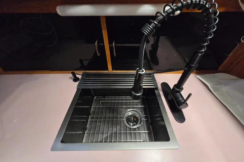 Slide: The Image of Stainless steel sink with modern faucet on 1988 Mainship 36 Double Cabin yacht. - 34