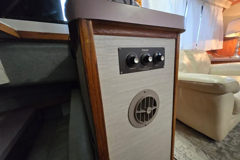 Slide: The Image of 1988 Mainship 36 Double Cabin interior with control panel and vent. - 35