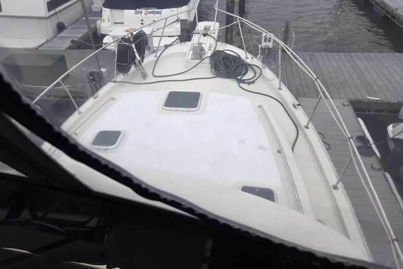 Slide: The Image of 1988 Mainship 36 Double Cabin yacht docked at marina, view from deck. - 42