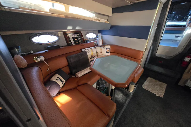 Slide: The Image of Interior of 1988 Bayliner 3450 Avanti with sink and mirror in cabin. - 14